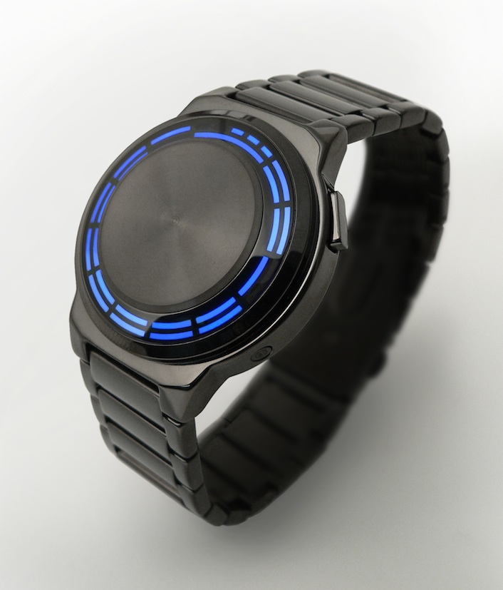 The Kisai RPM watch: a round dark gunmetal case and bracelet, with blue LED segments arranged in rings around a brushed metal centre